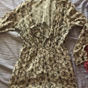Iron fist skull print long sleeve tan romper